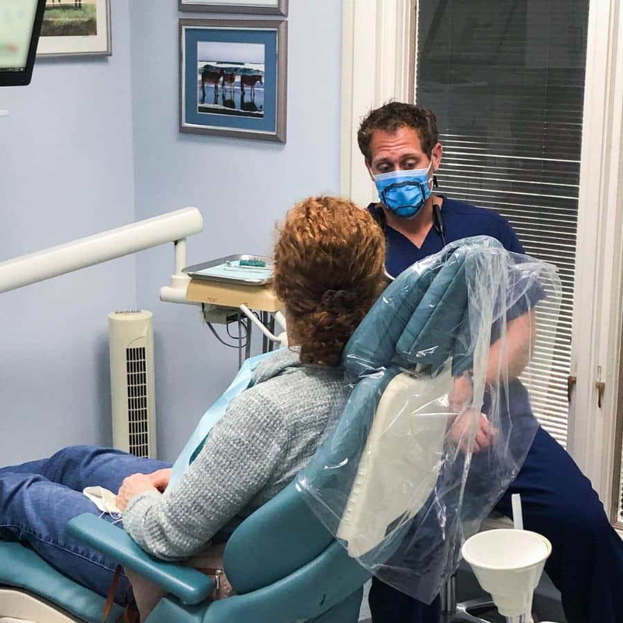 Dentist discussing sleep apnea treatment options with a patient at beach dental center in virginia beach, va.